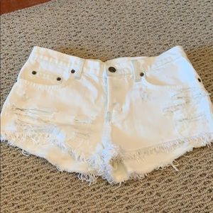 carmar white mid rise distressed jeans w/ fringe
